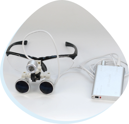 MAGNIFICATION HEADLIGHT ILLUMINATION SYSTEM